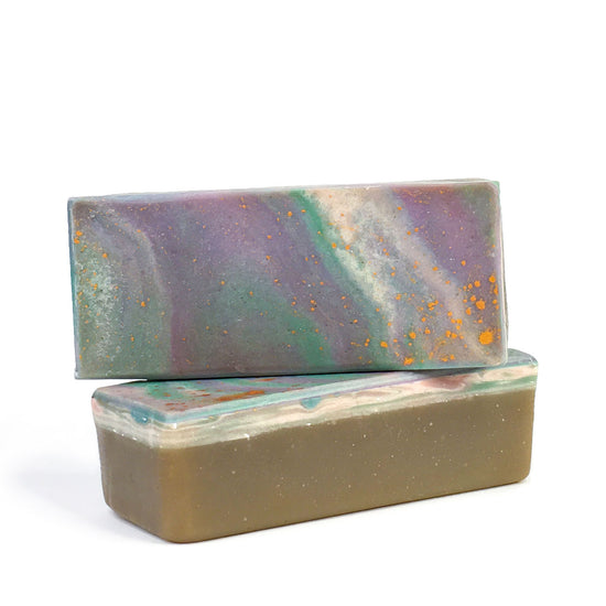 abstract green soap with purple and white splatter and golden sparkles