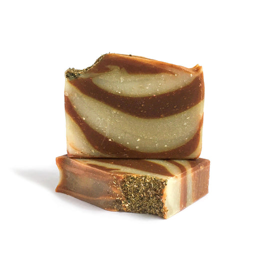 brown and yellow soap bars with chamomile on top