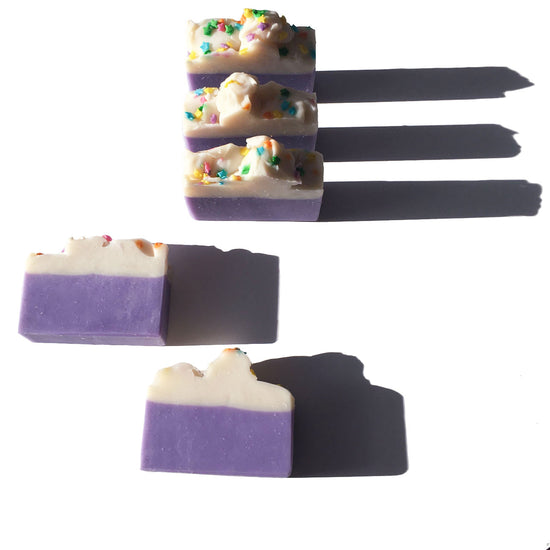purple and white bar soaps with star shape sprinkles on top, cloud soap design, soap cake, dessert soap