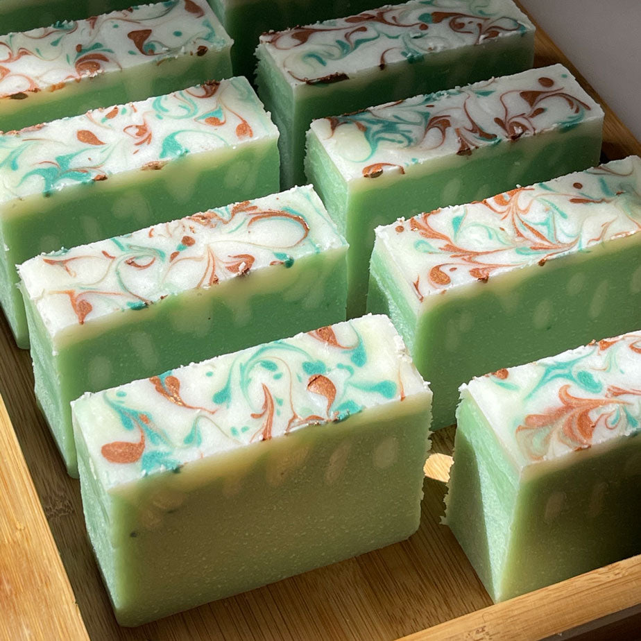 10 jasmine green soap bars with swirly top in the bamboo plate box