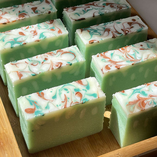 Load image into Gallery viewer, 10 jasmine green soap bars with swirly top in the bamboo plate box
