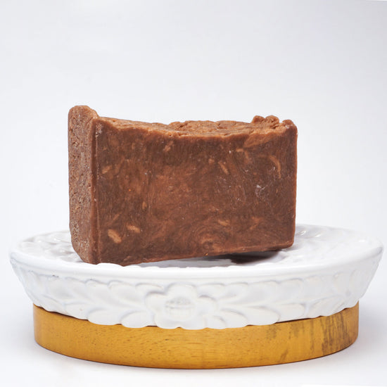 rustic brown soap bar on a soap dish