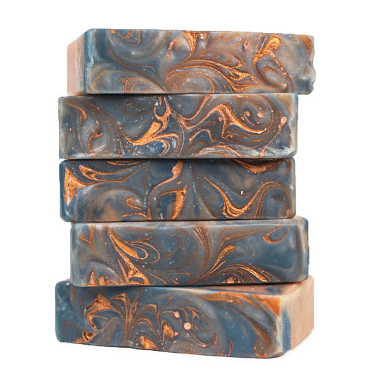 stalk of Sandalwood & Amber Bar Soaps with swirly golden top