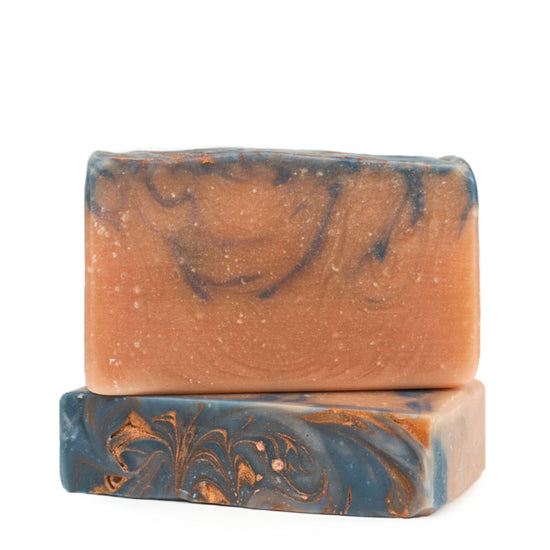 Two of Sandalwood & Amber Bar Soaps with swirly golden top