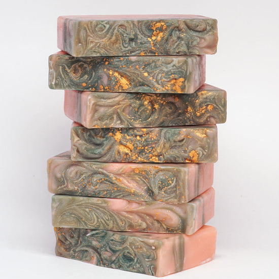 Stalk of swirly top soap bars with golden sparkles