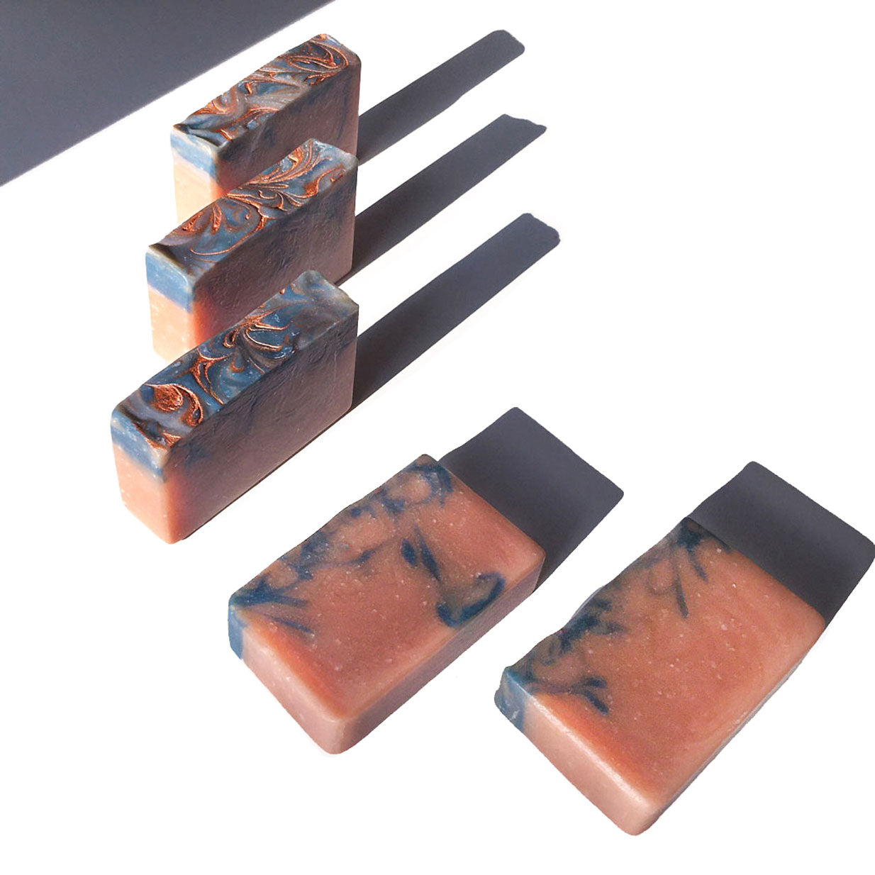 Load image into Gallery viewer, stalk of Sandalwood &amp;amp; Amber Bar Soaps with swirly golden top
