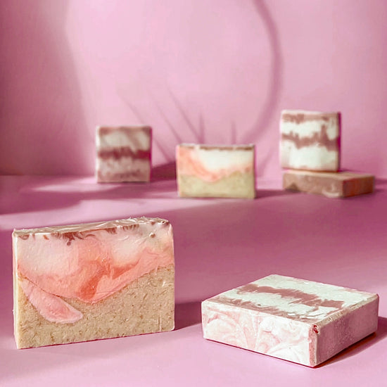 swirly soap design on a pink background
