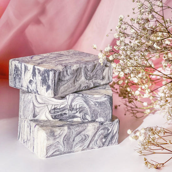 stalk of marble soap bars on a table flower in the corner